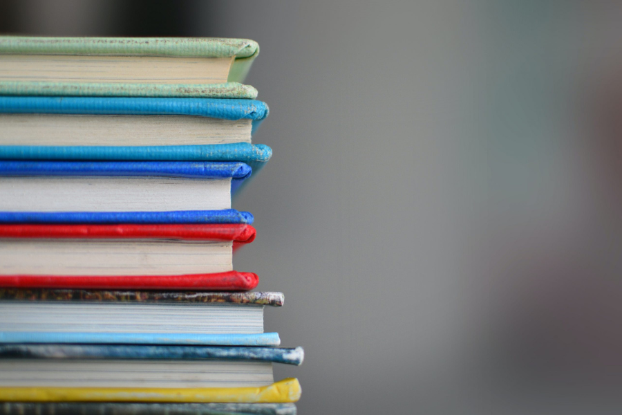 colorful stacked books - Incubeta Digital Academy